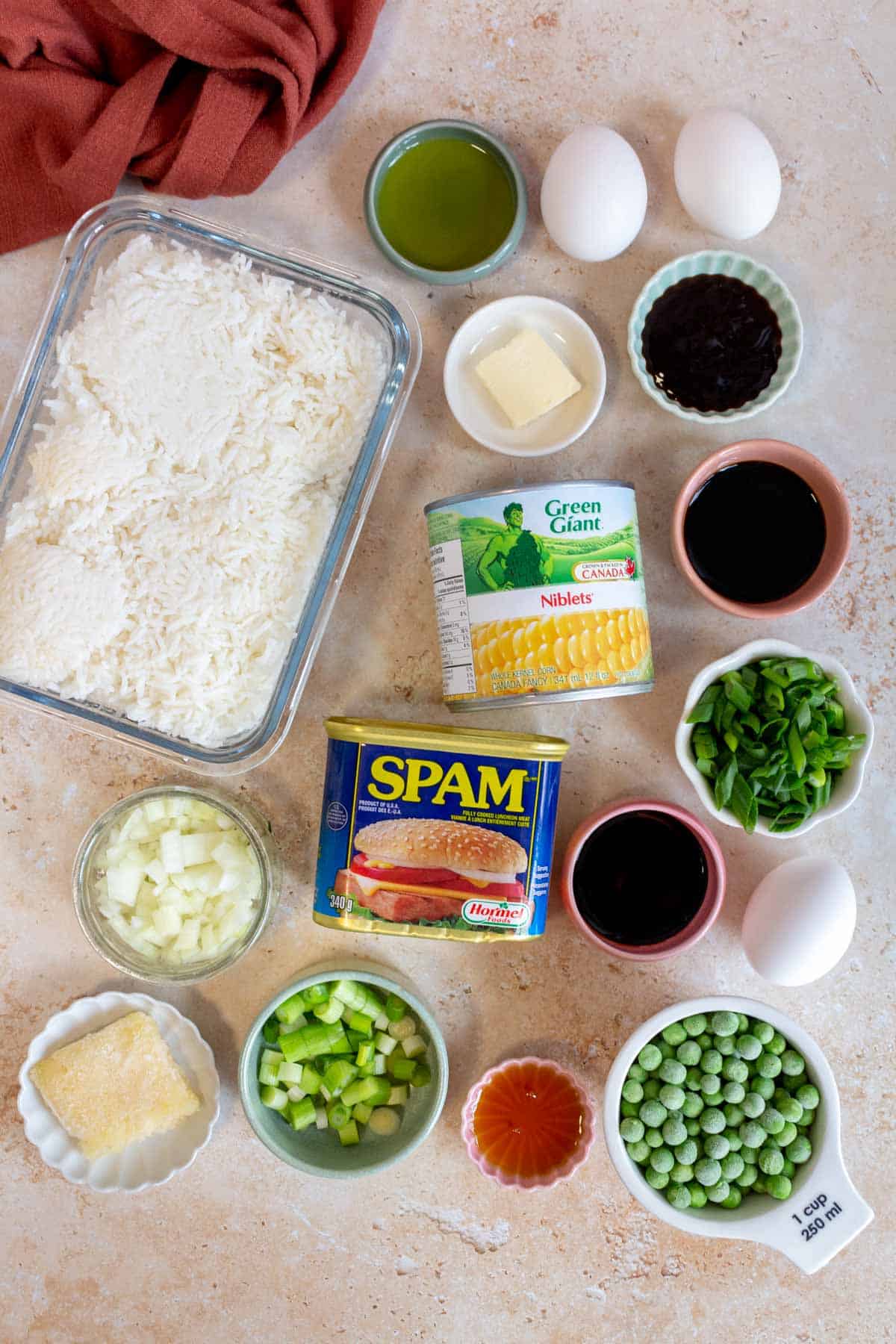 Ingredients needed to make spam fried rice.