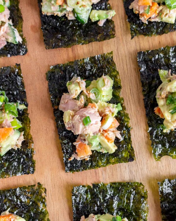 Overhead view of tuna seaweed snack bites on a serving board.