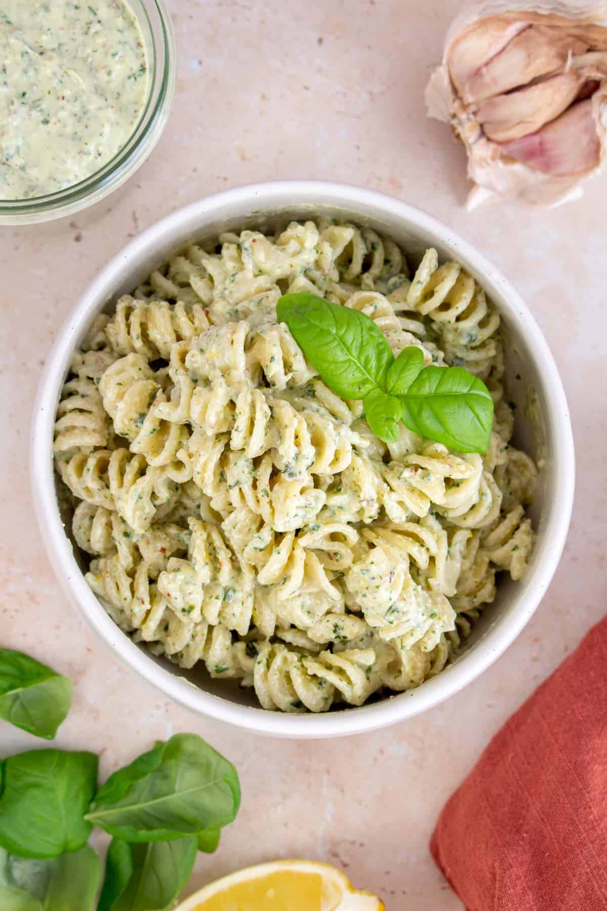 A bowl of pasta coated in ricotta pesto.
