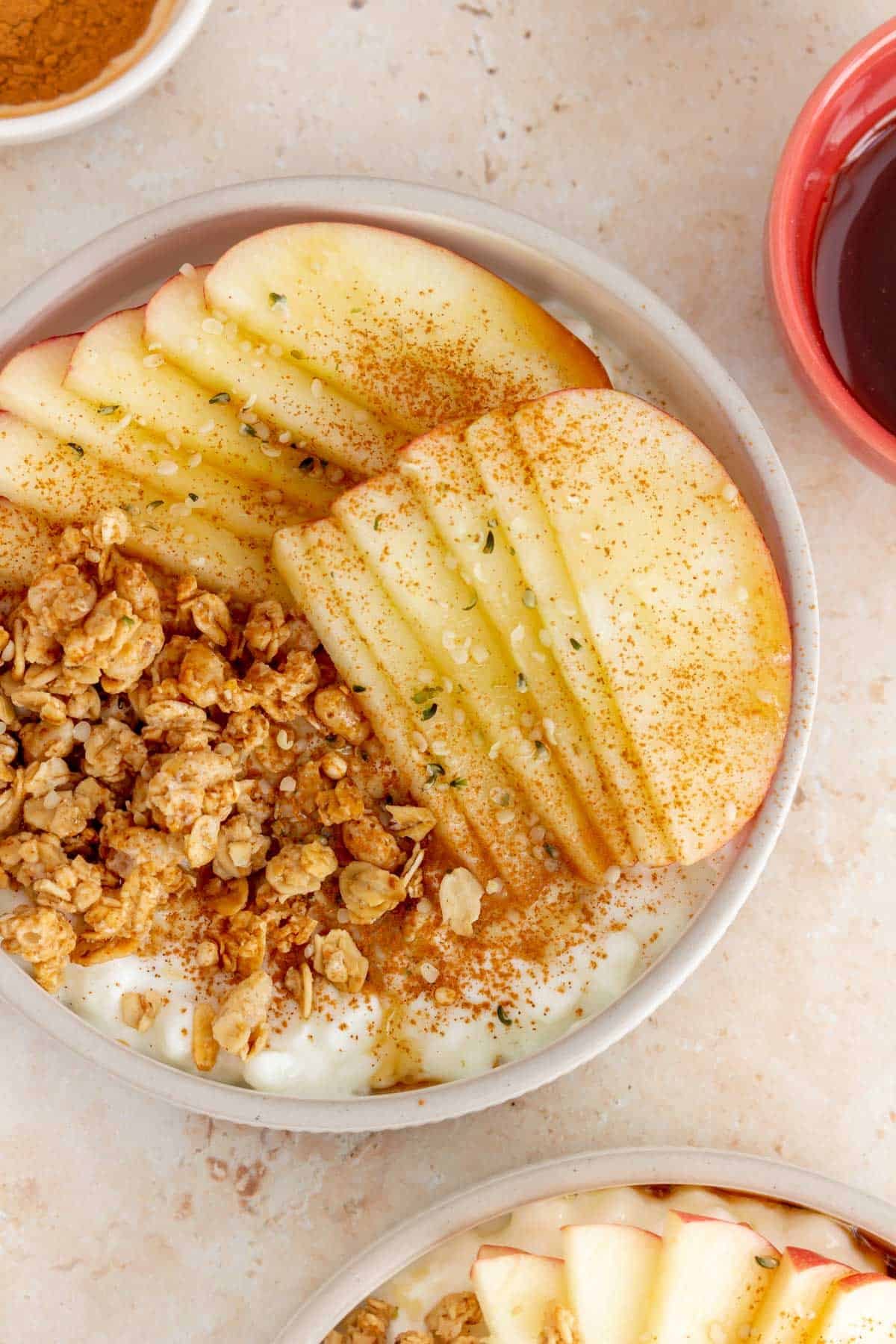 A close up view of a cottage cheese apple cinnamon bowl.