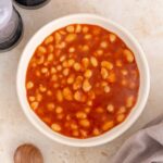A bowl of baked beans.
