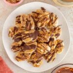 Overhead view of a platter of banana snickers bites.