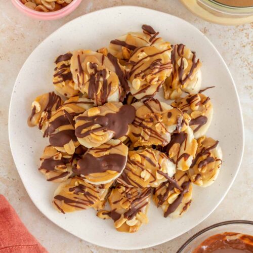 Overhead view of a platter of banana snickers bites.