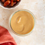 Overhead view of a jar of date caramel.