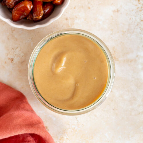 Overhead view of a jar of date caramel.