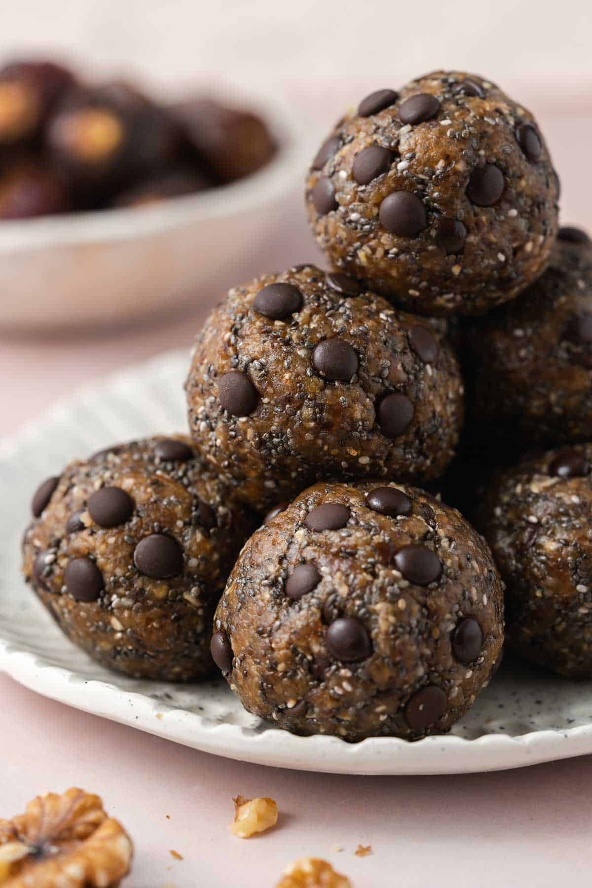 A plate with a pile of nut date balls.