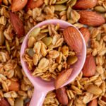 A spoonful of vanilla almond granola over more granola.