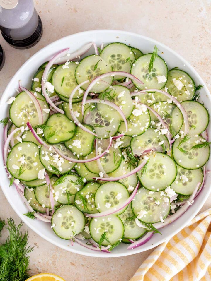 Overhead view of a bowl of cucumber feta salad.