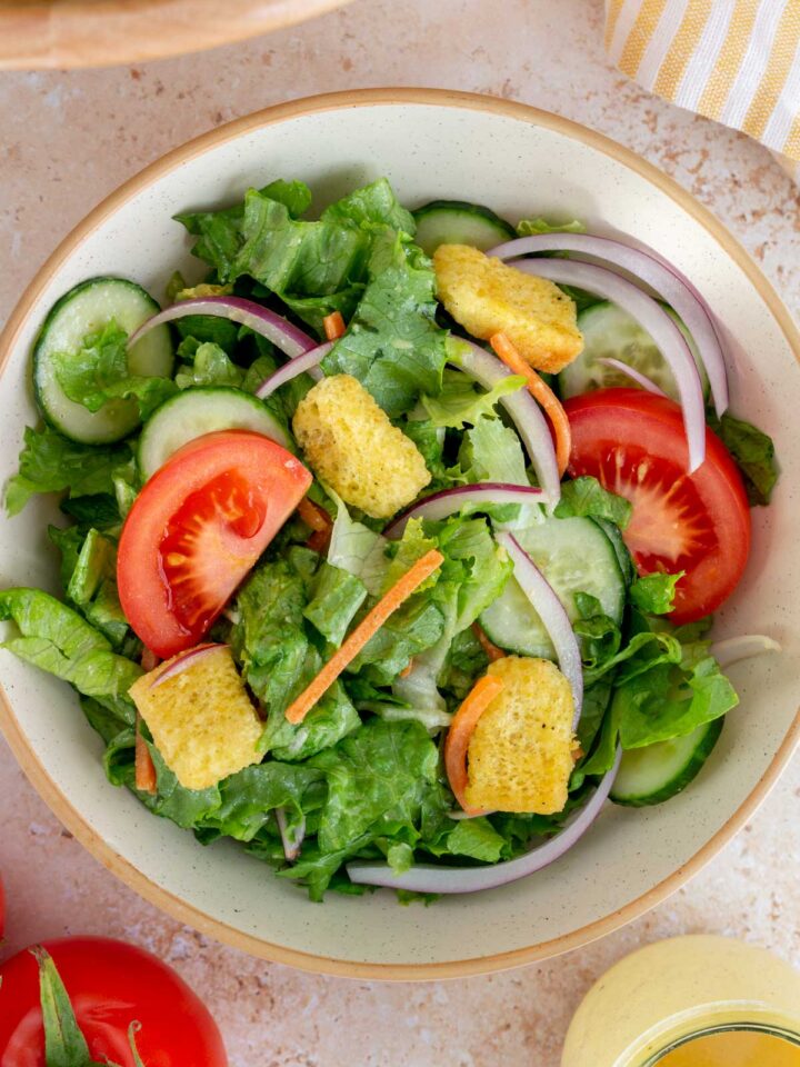 Close up view of a bowl of house salad.