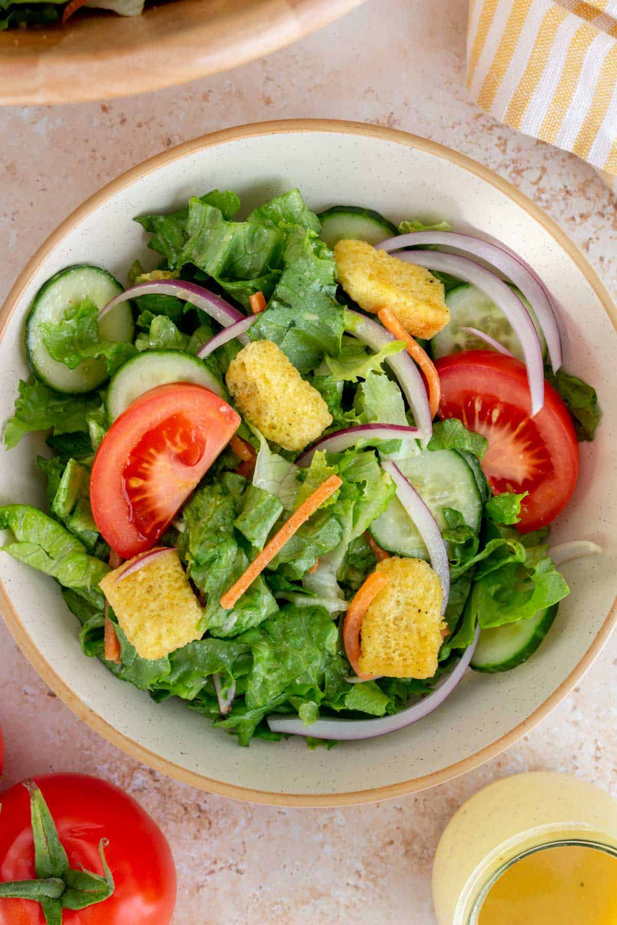 Close up view of a bowl of house salad.