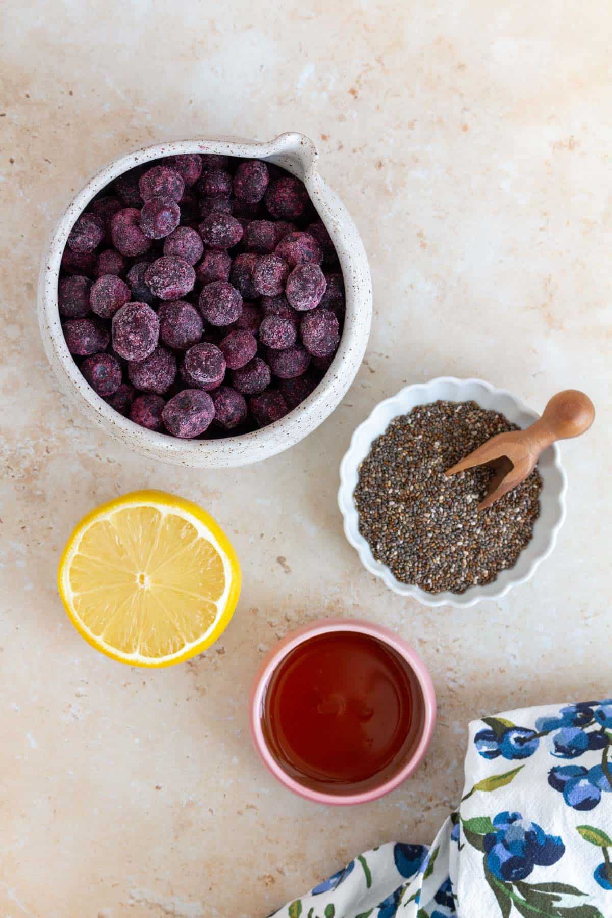 Ingredients needed to make blueberry chia jam.