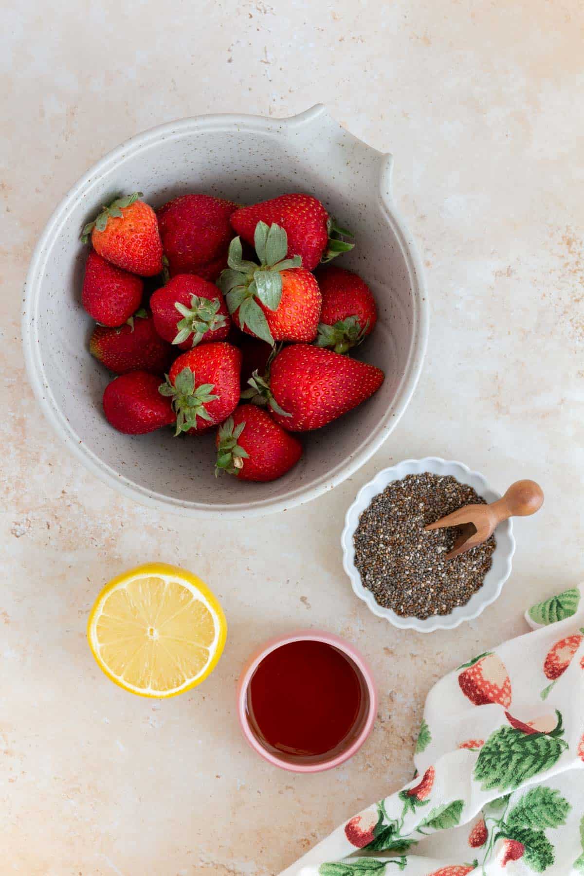 Ingredients needed to make strawberry chia jam.
