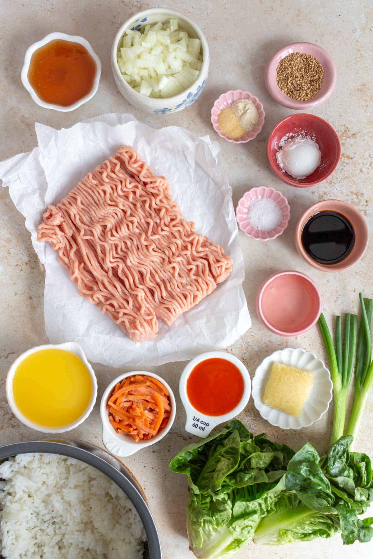 Ingredients needed to make spicy orange chicken lettuce wraps.