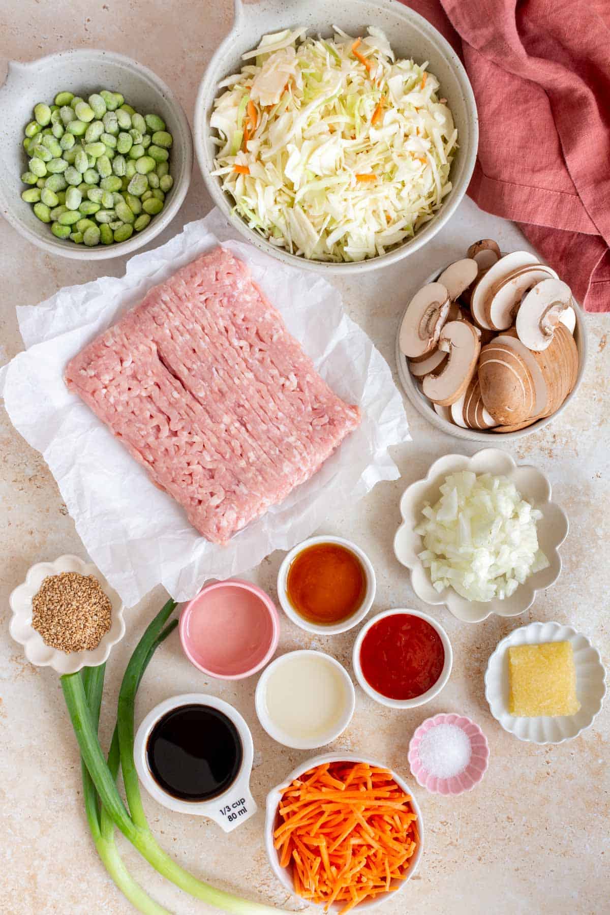 Ingredients needed to make a veggie packed ground turkey egg roll in a bowl.