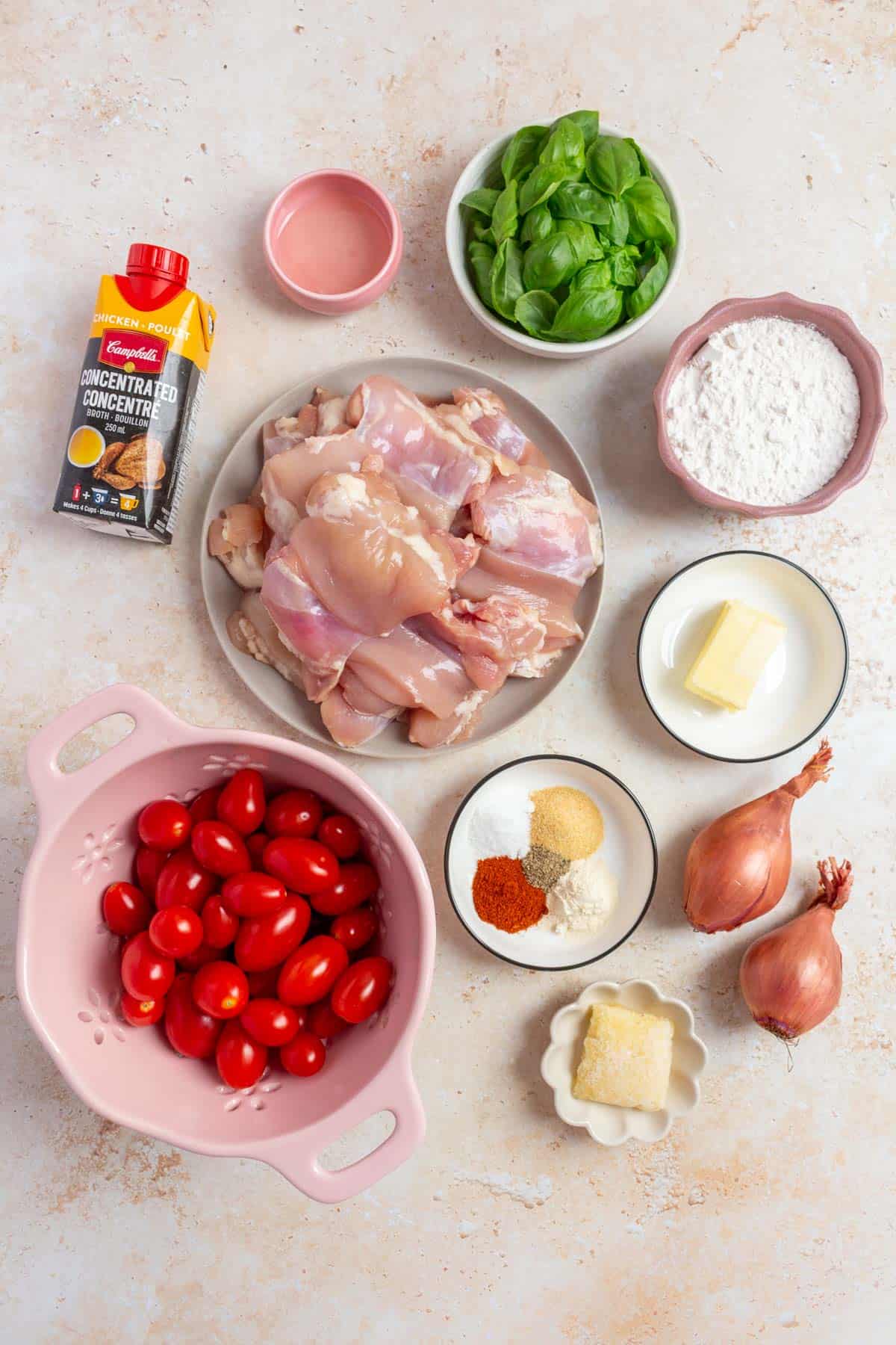 Ingredients needed to make one pan tomato basil chicken thighs.