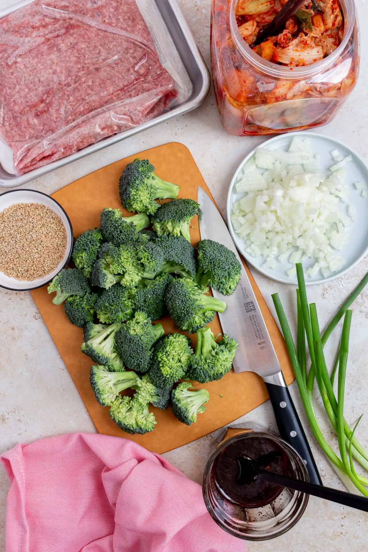 Ingredients needed to make gochujang beef and broccoli and kimchi.
